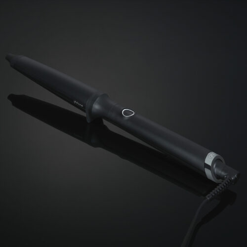 Boucleur GHD Creative Curl Wand pour des boucles souples et définies avec une température constante de 185°C.